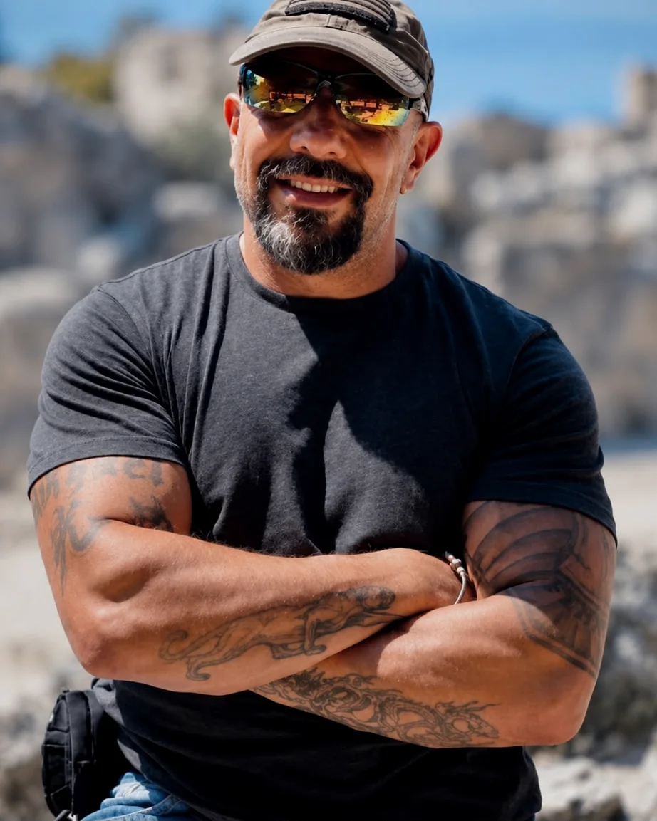 Ray Mancini, founder of the T×P Method, arms crossed, smiling, outdoors